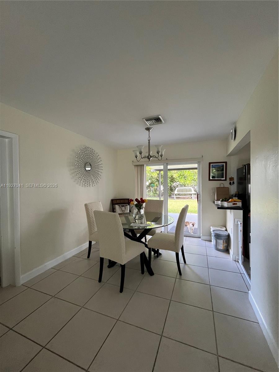 10011 Southwest 162nd Street Miami, FL 33157 - Photo 6 of 18 a dining room with furniture and window