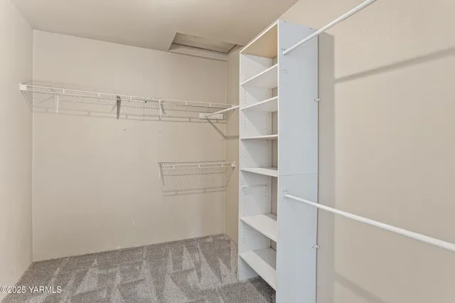 a view of an empty walk in closet
