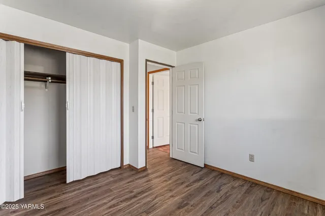 a bathroom with a sink vanity granite and toilet