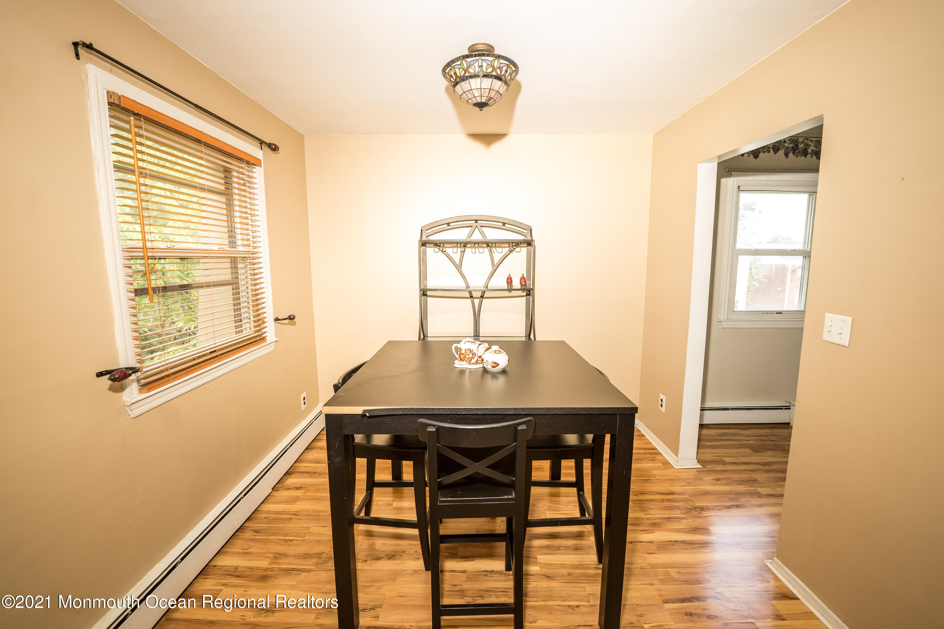 420 Cross Road, Unit B2 Matawan, NJ 07747 - Photo 2 of 8 a view of a dining room with furniture and wooden floor