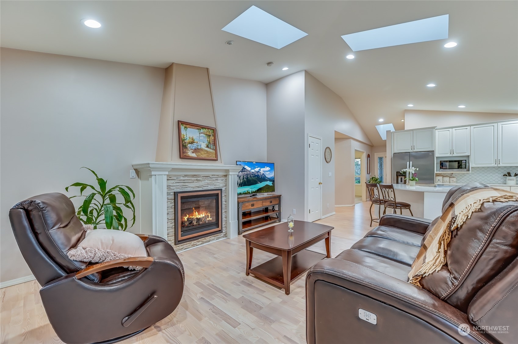 2504 240th Street Southeast Bothell, WA 98021 - Photo 14 of 40 a living room with furniture and a fireplace