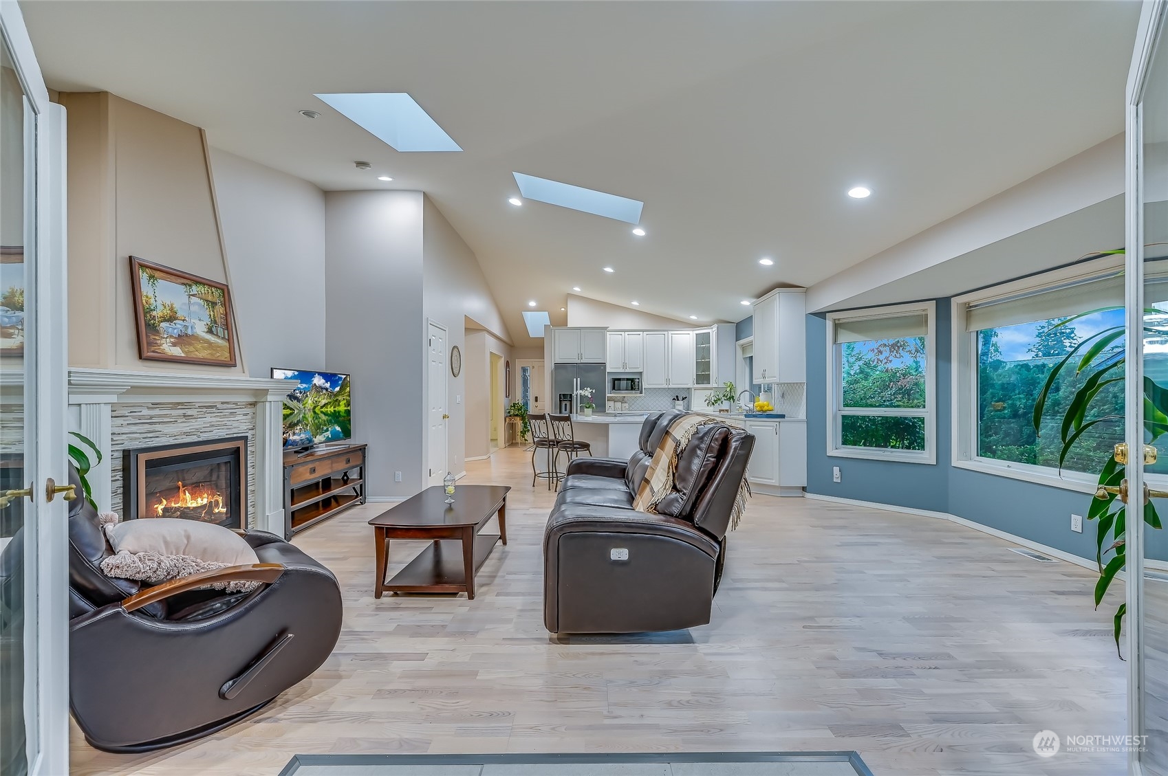 2504 240th Street Southeast Bothell, WA 98021 - Photo 15 of 40 a living room with fireplace furniture and a large window