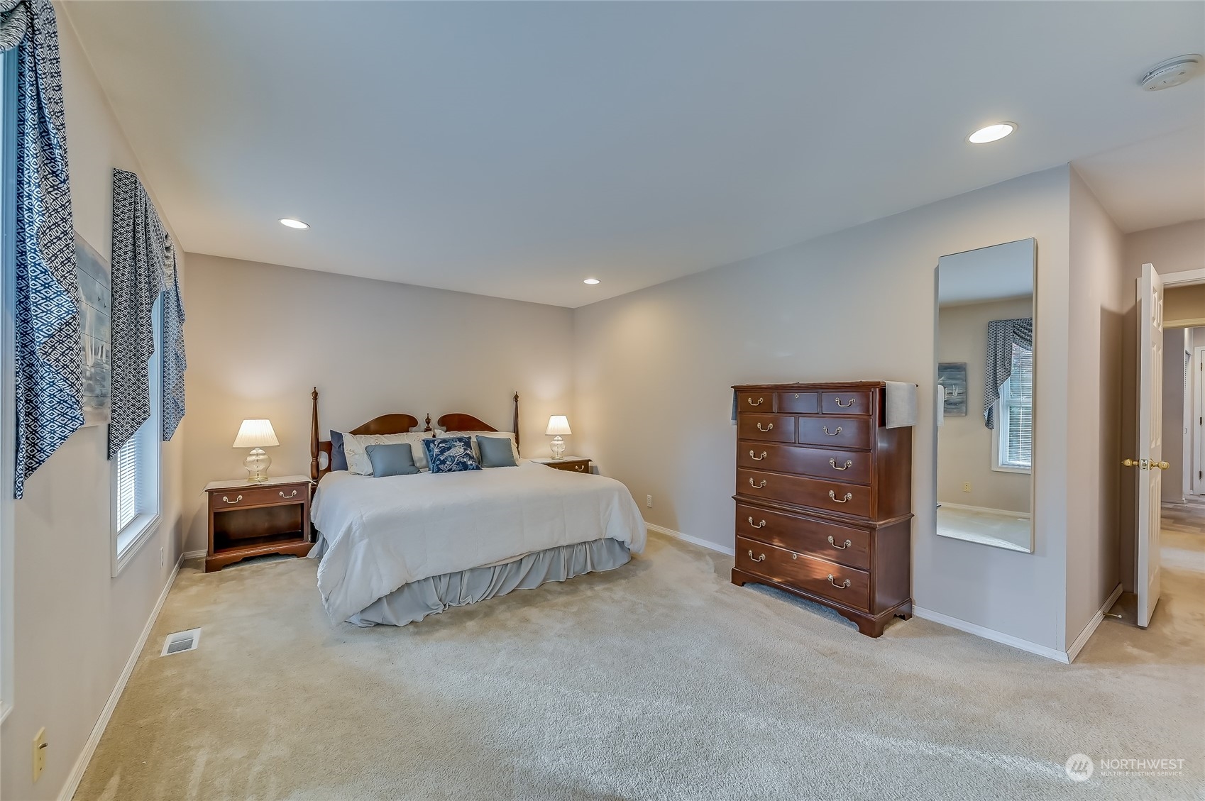 2504 240th Street Southeast Bothell, WA 98021 - Photo 17 of 40 a spacious bedroom with a bed and a cabinets