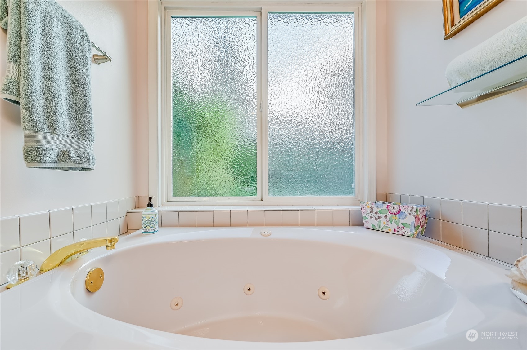 2504 240th Street Southeast Bothell, WA 98021 - Photo 22 of 40 a white bath tub sitting next to a window