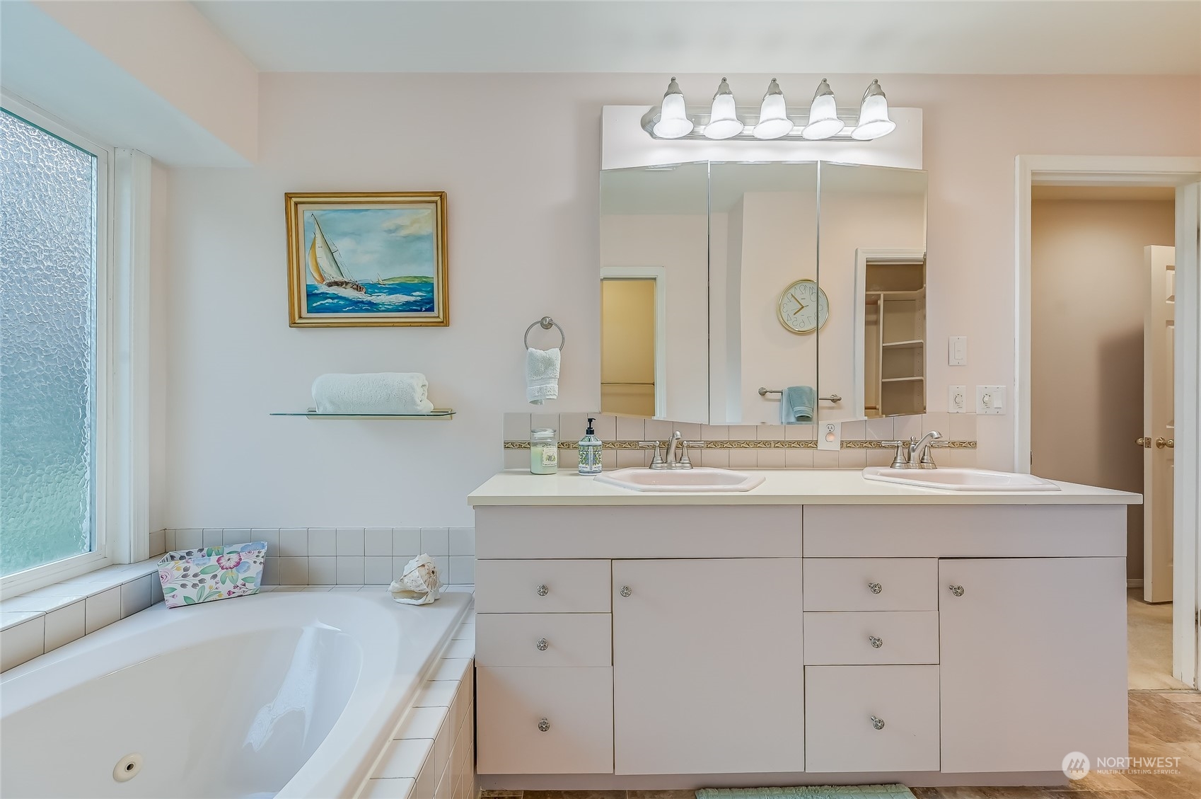 2504 240th Street Southeast Bothell, WA 98021 - Photo 23 of 40 a bathroom with a double vanity sink mirror and bathtub