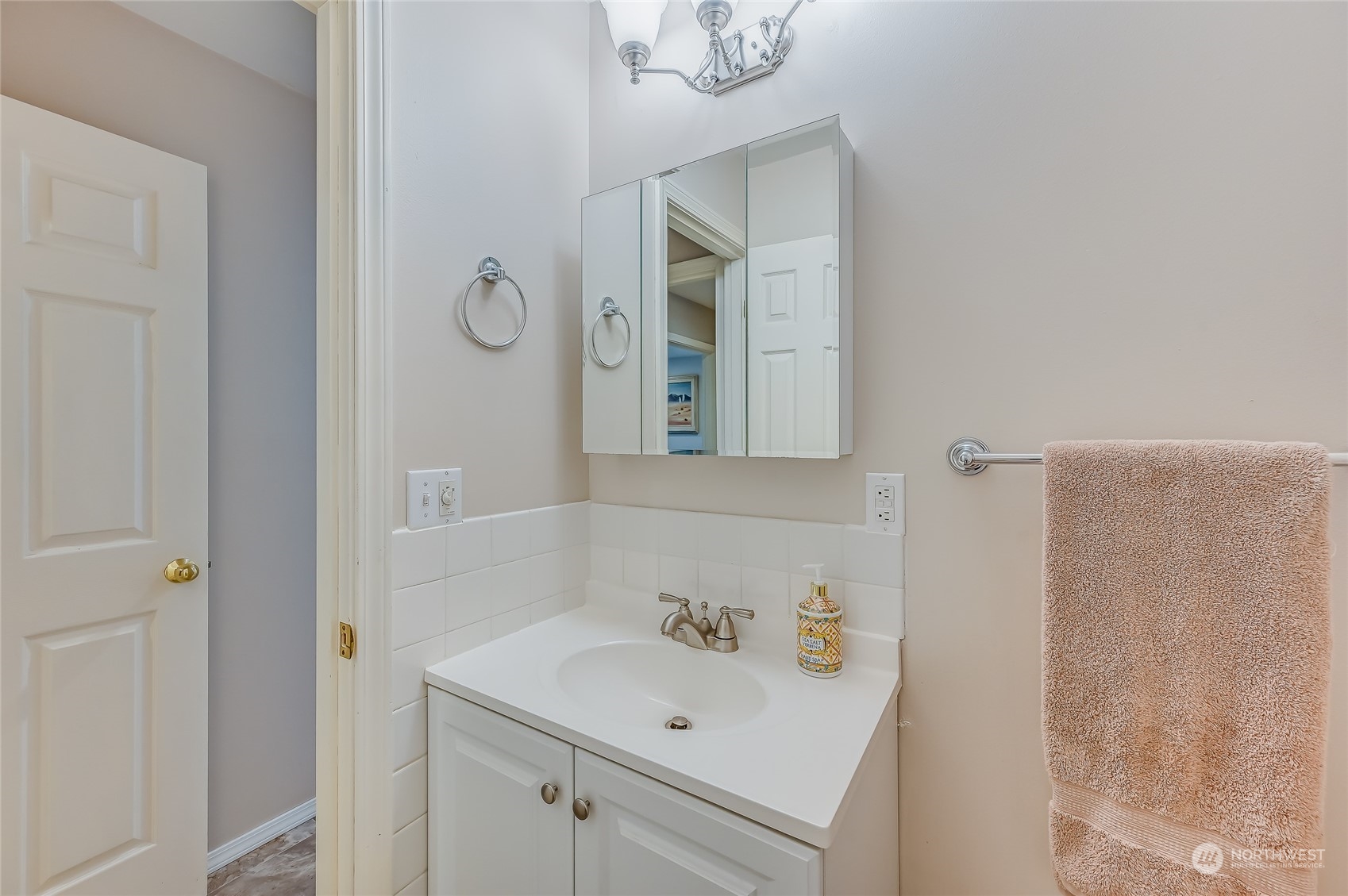 2504 240th Street Southeast Bothell, WA 98021 - Photo 29 of 40 a bathroom with a sink and a mirror