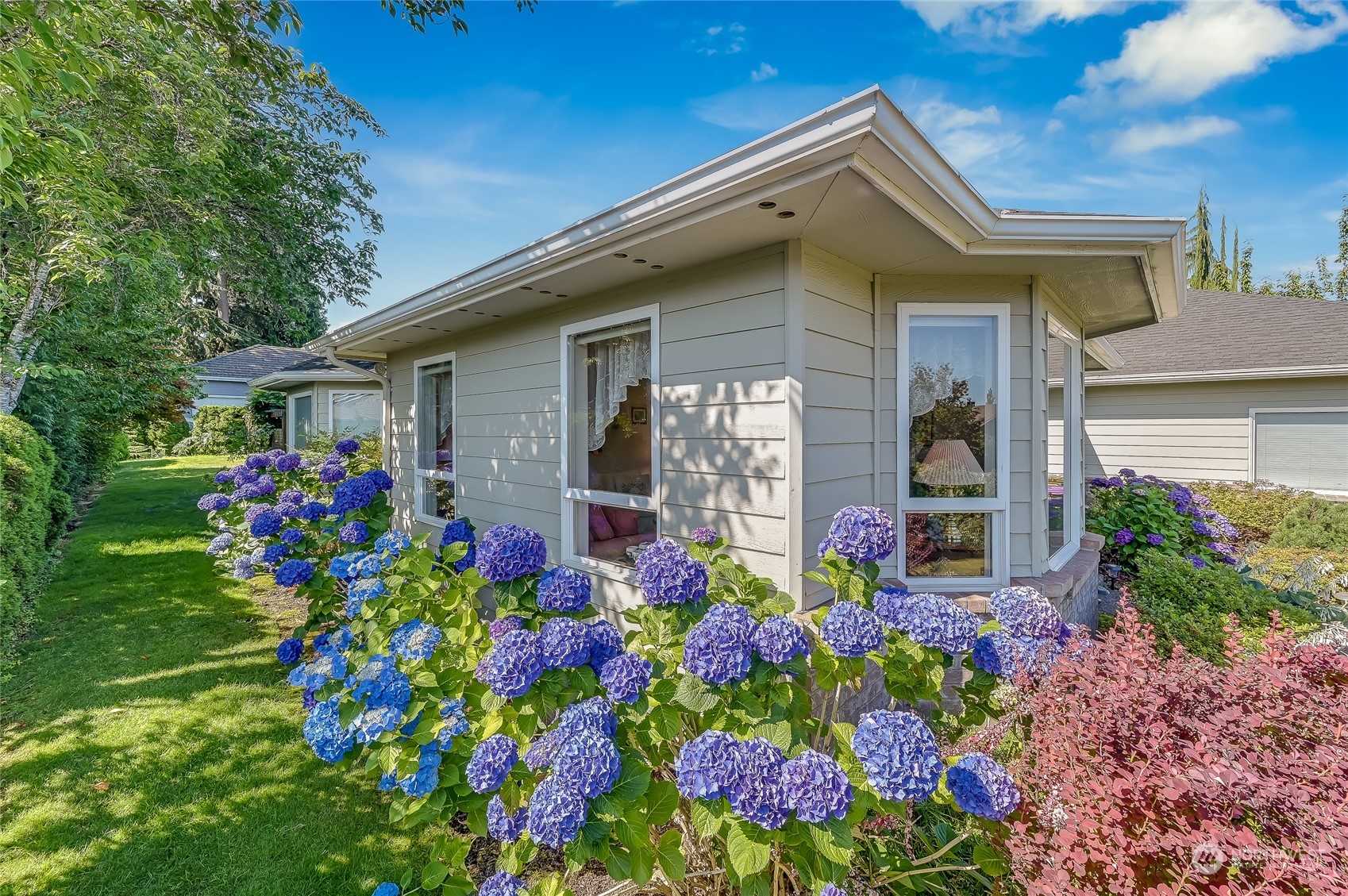 2504 240th Street Southeast Bothell, WA 98021 - Photo 31 of 40 a front view of house with flowers