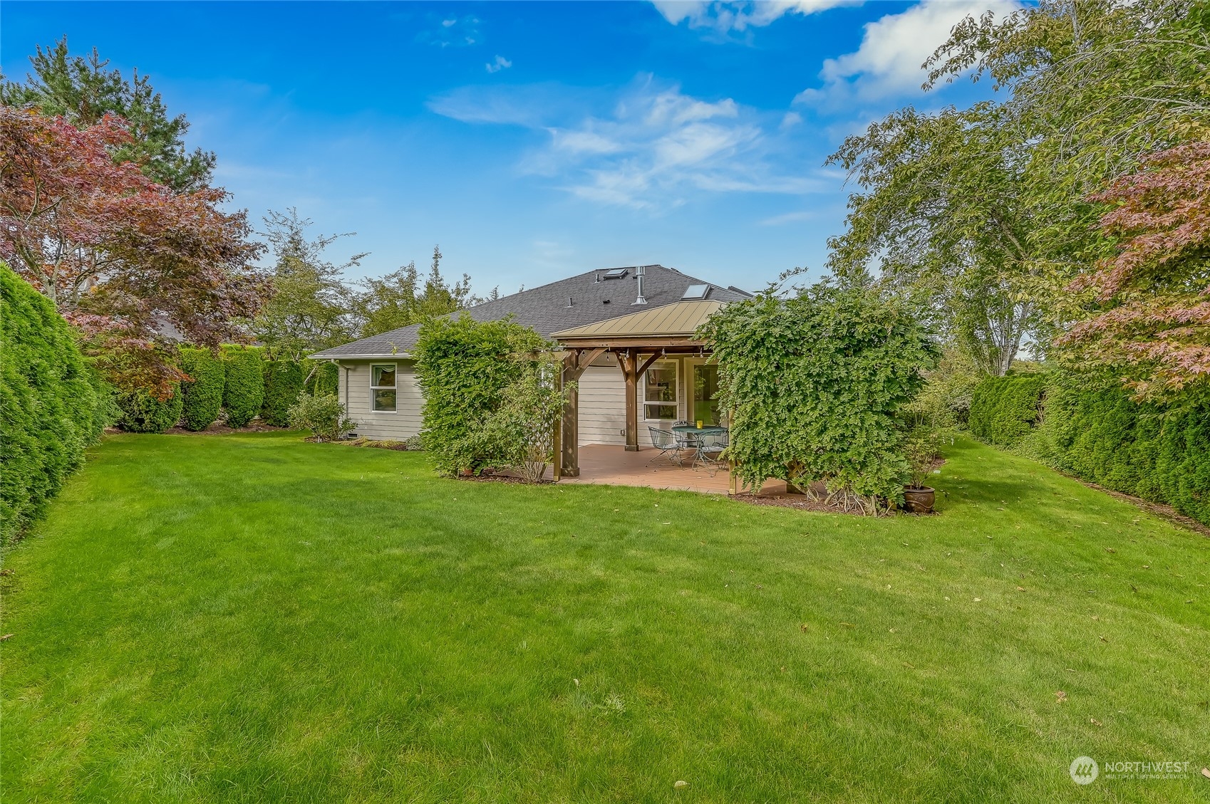 2504 240th Street Southeast Bothell, WA 98021 - Photo 32 of 40 a front view of a house with a garden