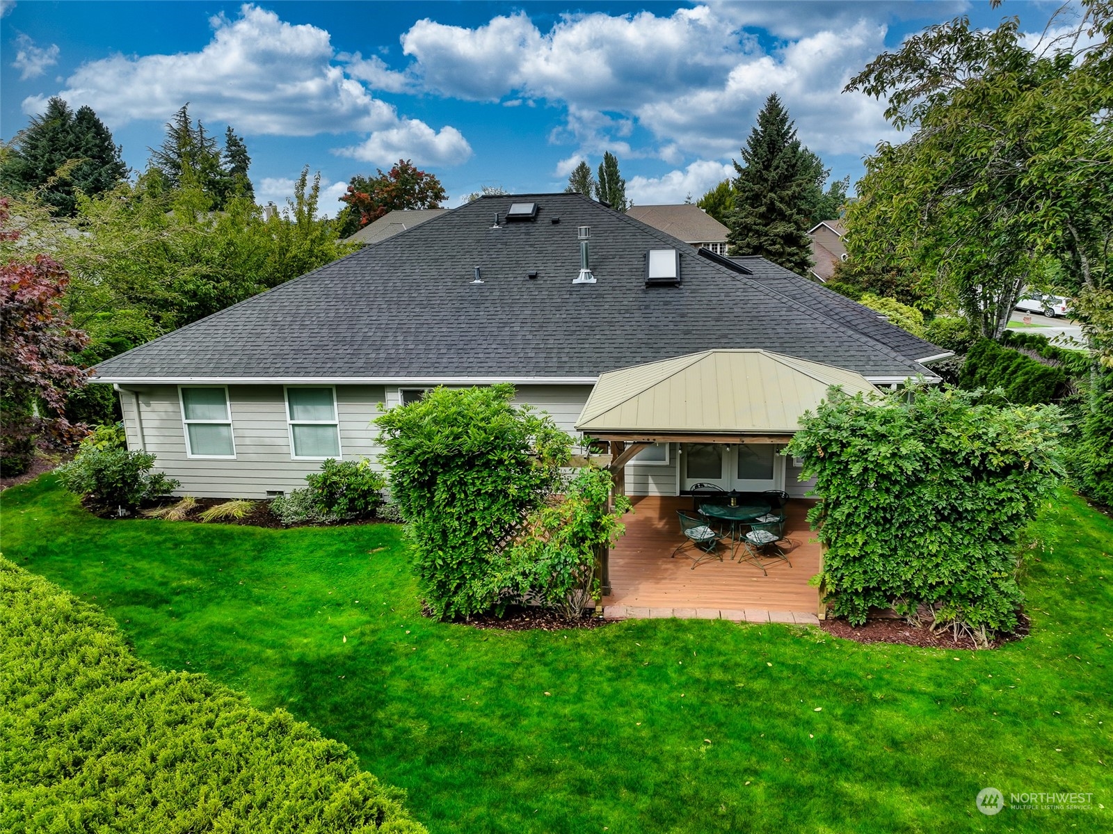 2504 240th Street Southeast Bothell, WA 98021 - Photo 36 of 40 a view of a house with a yard and sitting area