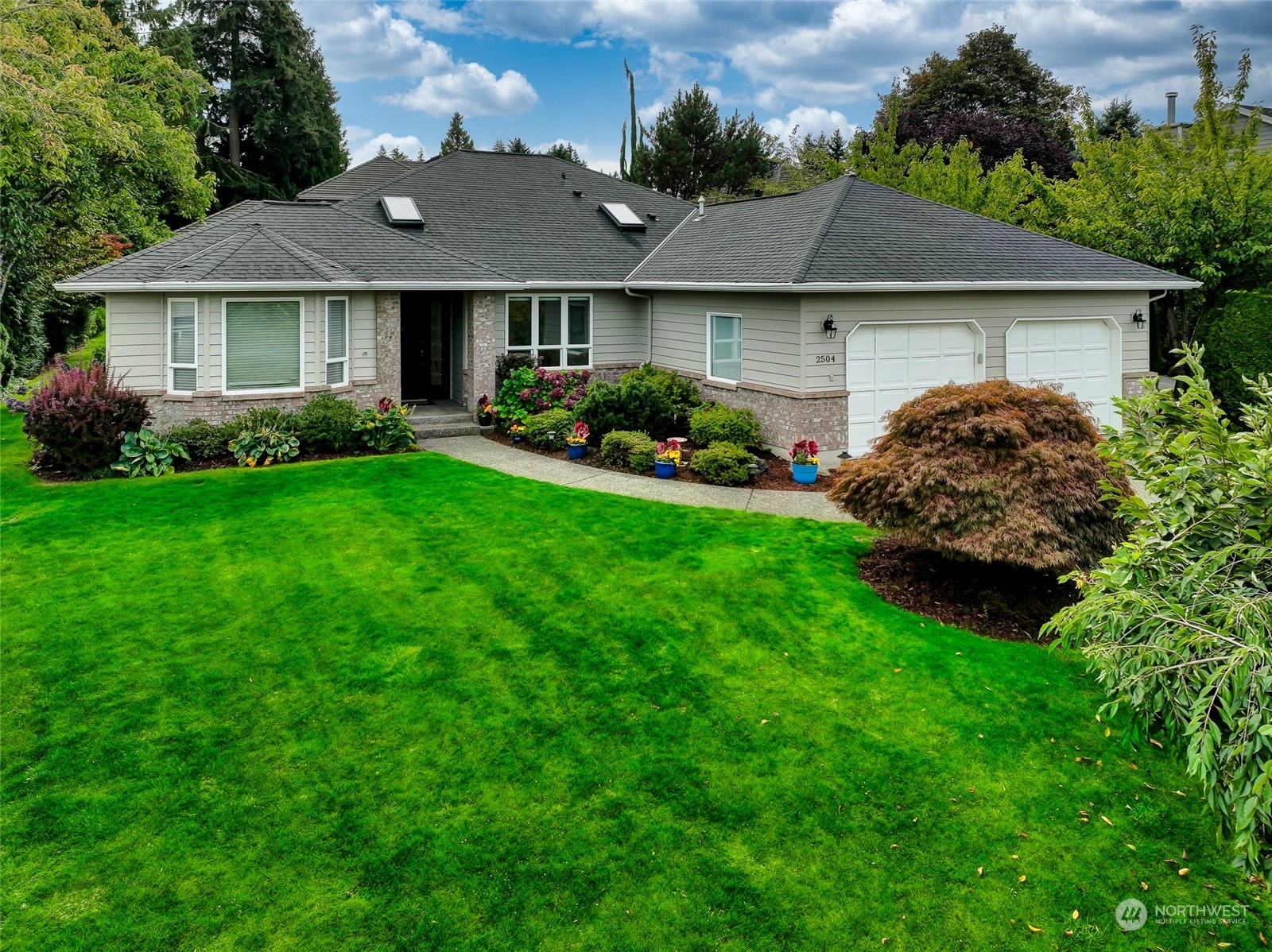 2504 240th Street Southeast Bothell, WA 98021 - Photo 39 of 40 a house that is sitting in the grass