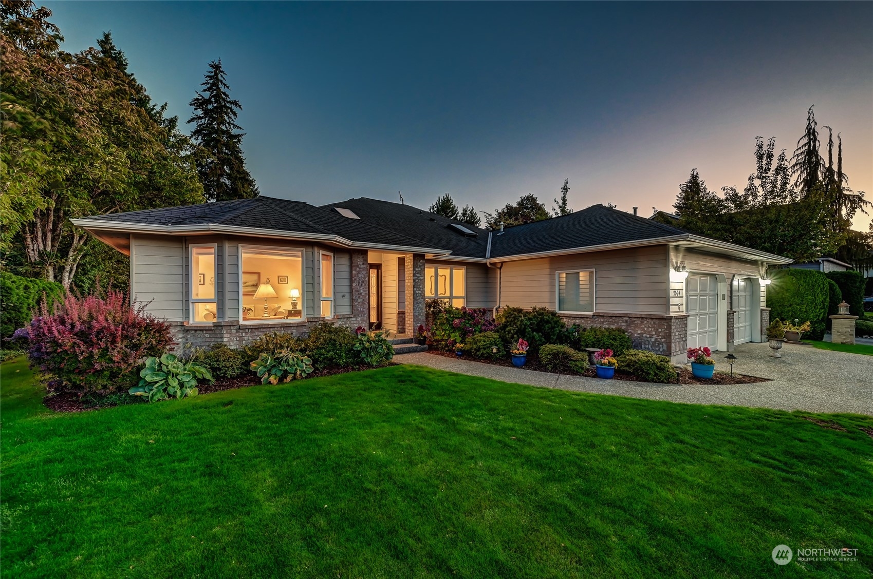 2504 240th Street Southeast Bothell, WA 98021 - Photo 40 of 40 a front view of a house with a garden