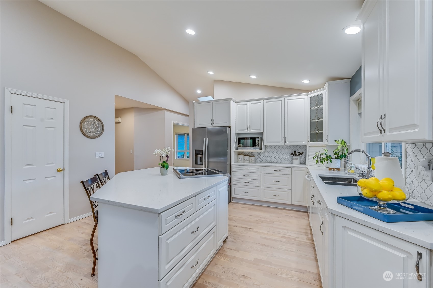 2504 240th Street Southeast Bothell, WA 98021 - Photo 10 of 40 a kitchen with white cabinets and stainless steel appliances