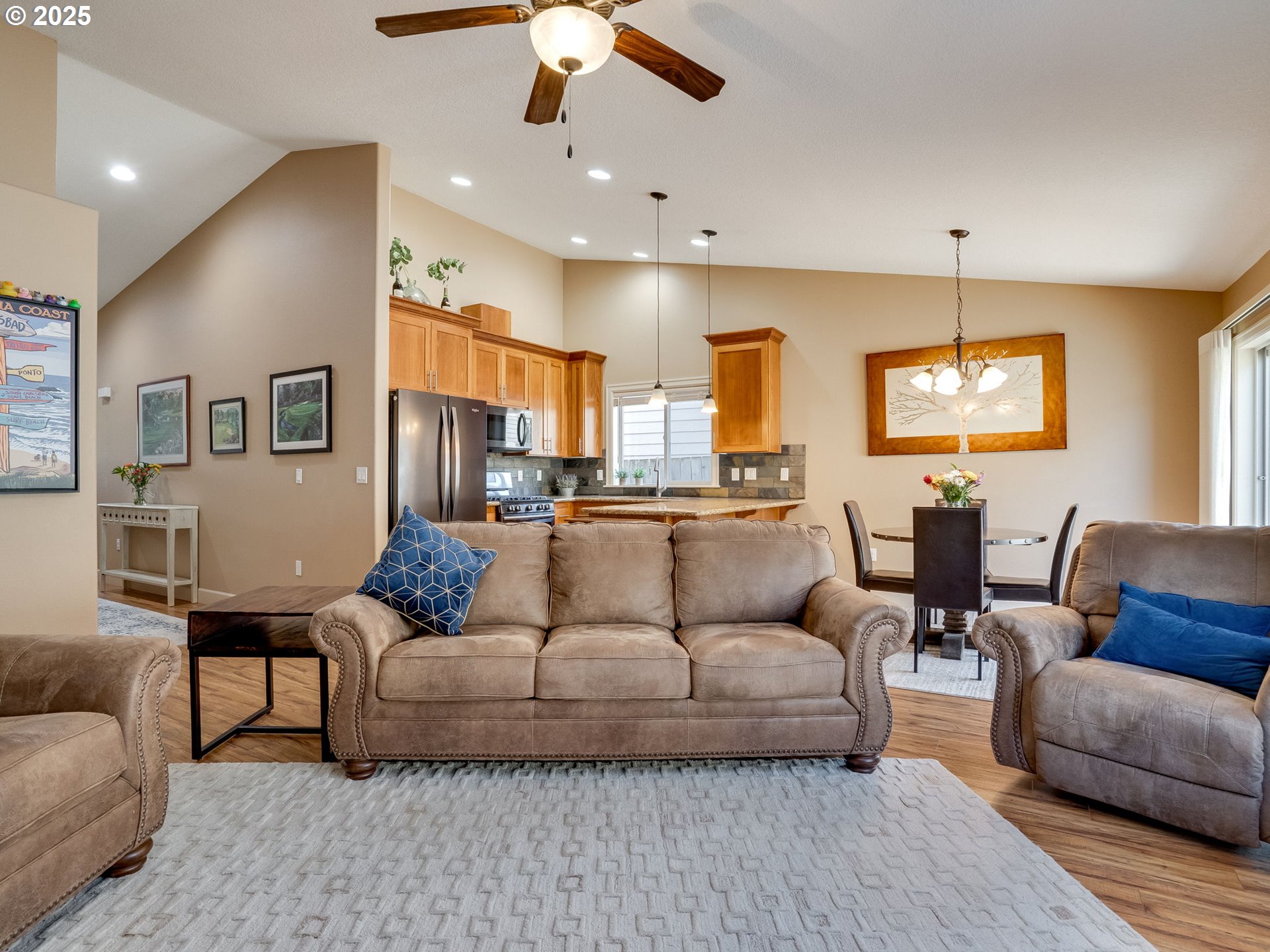 1047 Taurus Loop Northeast Keizer, OR 97303 - Photo 11 of 23 a living room with furniture and a chandelier
