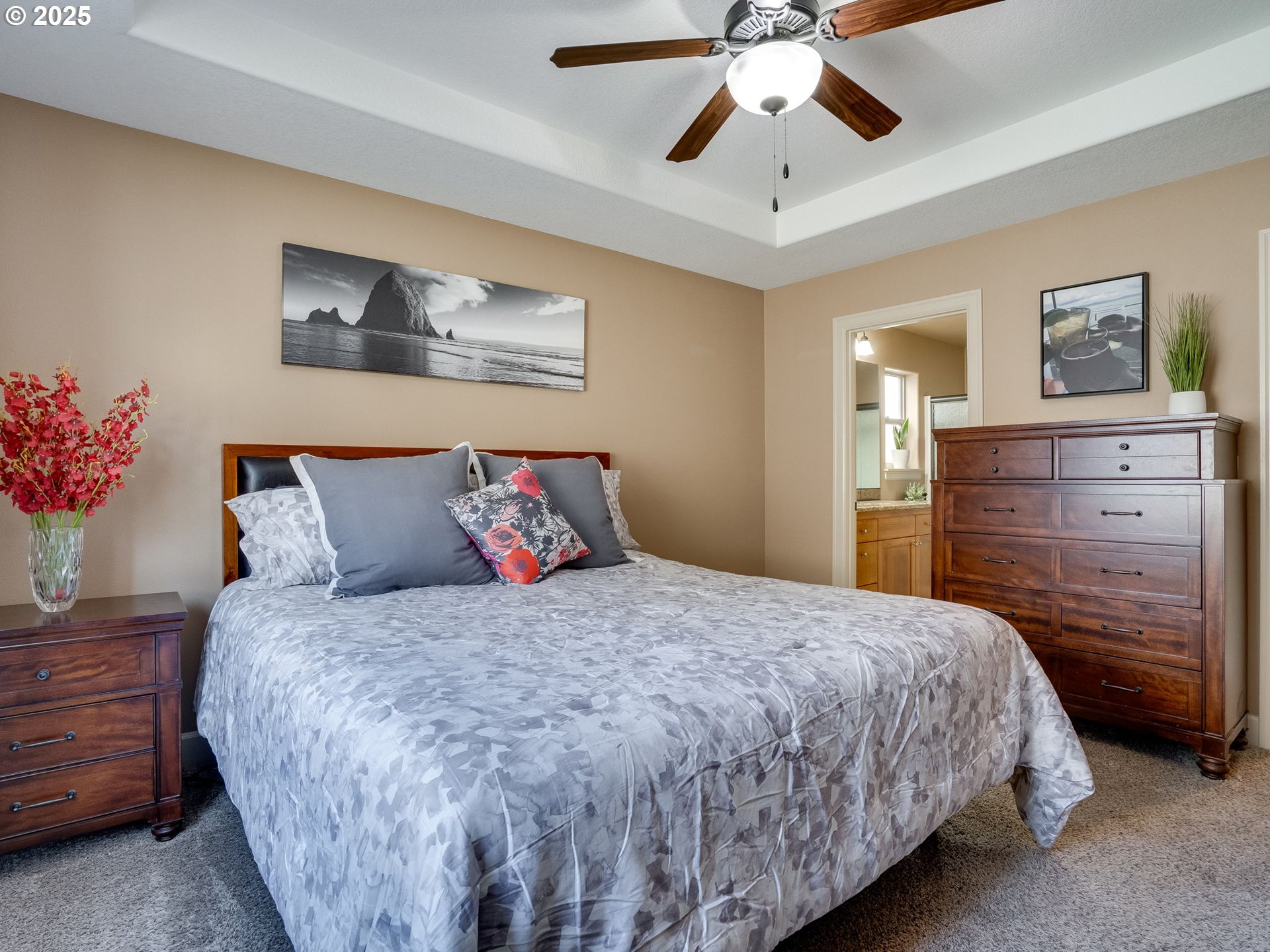 1047 Taurus Loop Northeast Keizer, OR 97303 - Photo 14 of 23 a bedroom with a bed and a chandelier