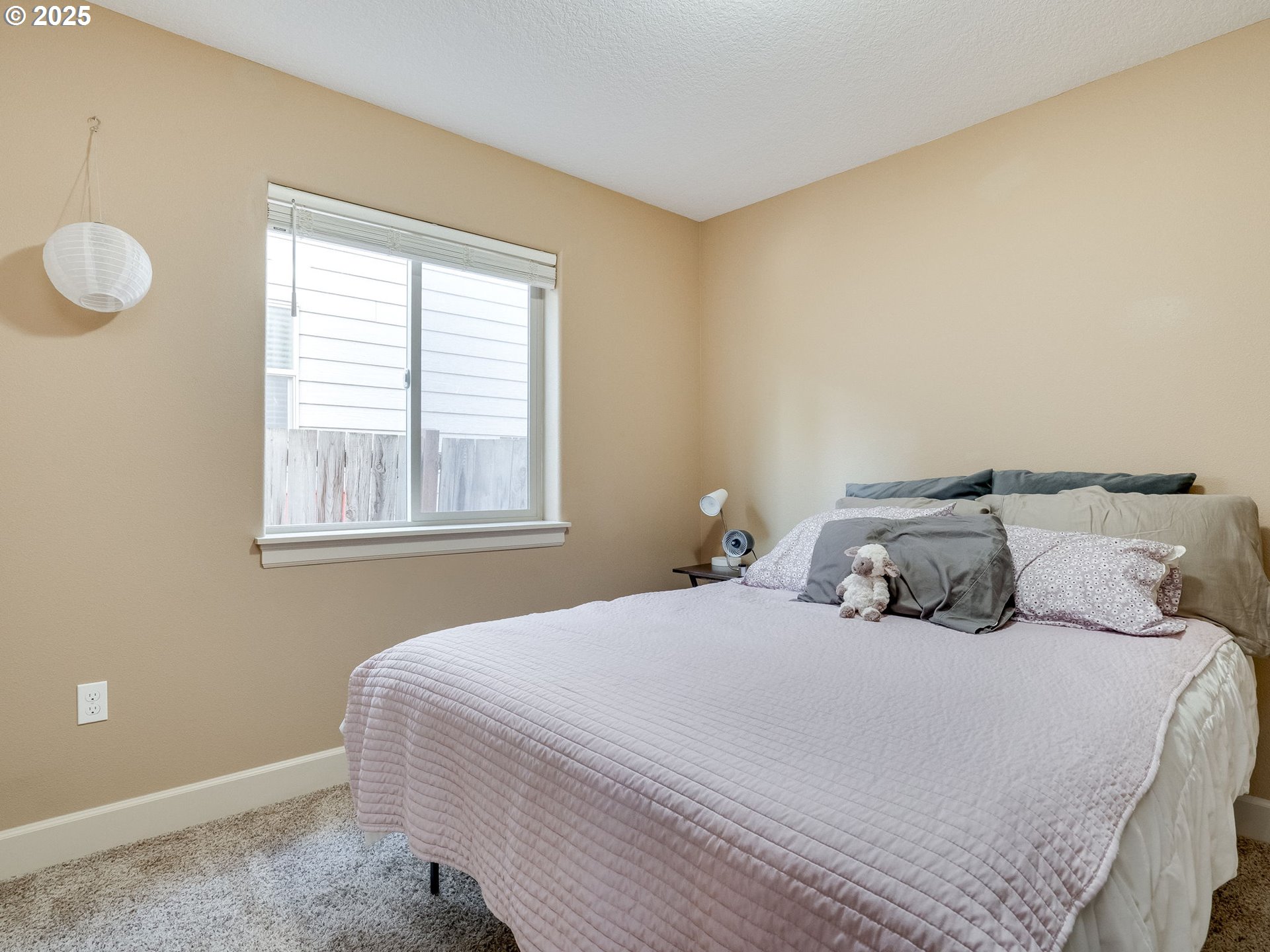 1047 Taurus Loop Northeast Keizer, OR 97303 - Photo 19 of 23 a bedroom with a bed and a window