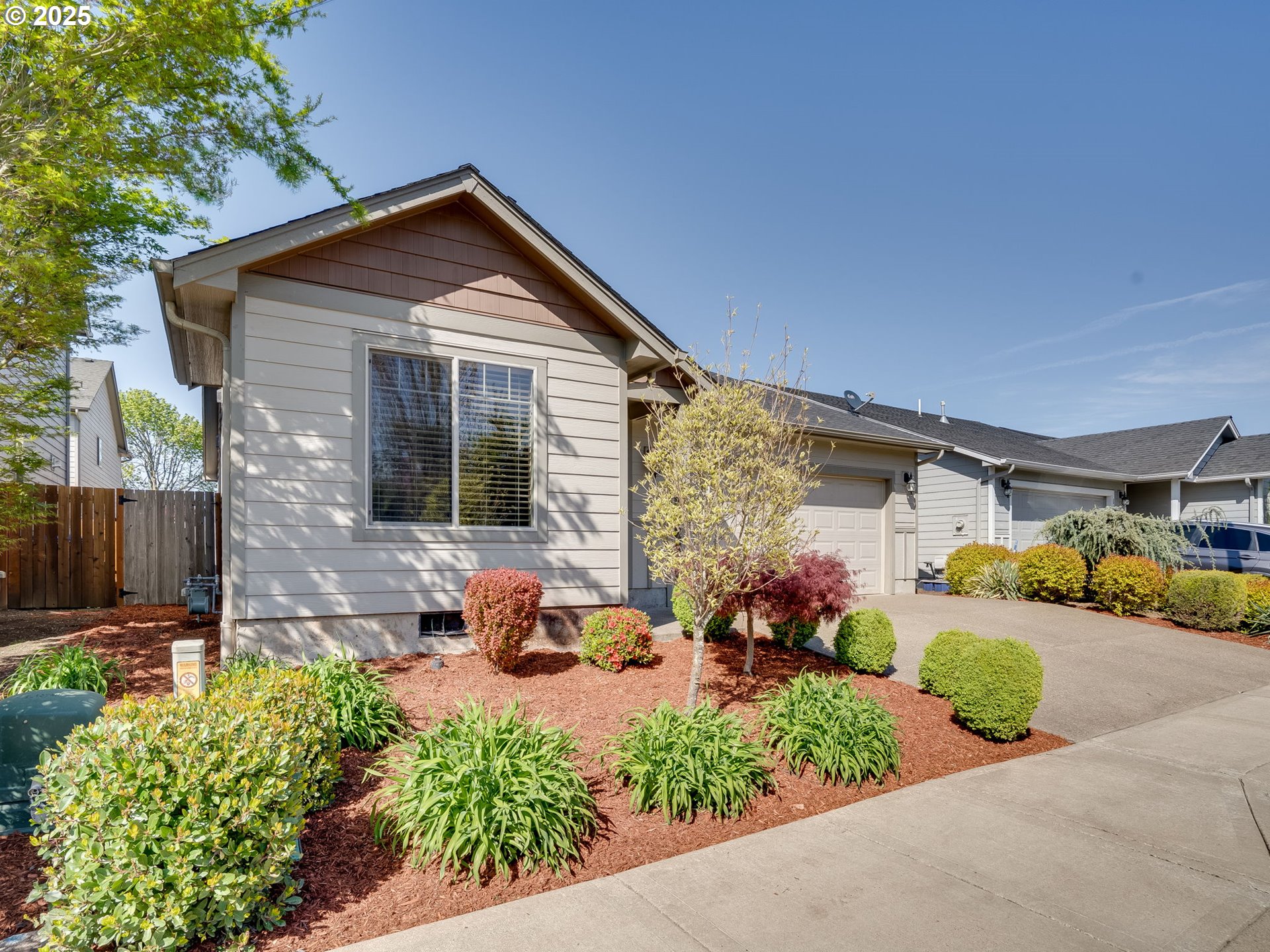 1047 Taurus Loop Northeast Keizer, OR 97303 - Photo 3 of 23 a front view of a house with a yard