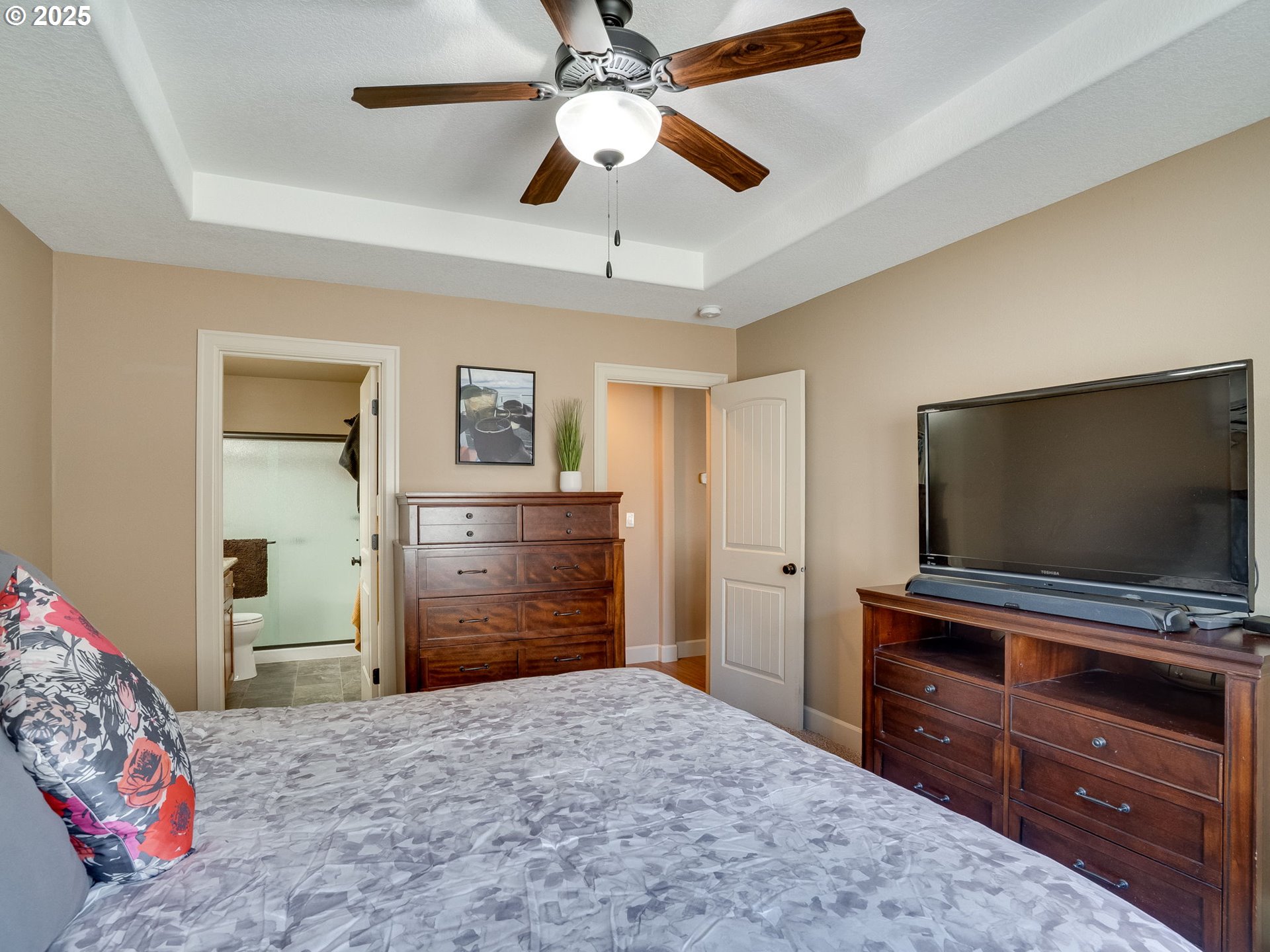 1047 Taurus Loop Northeast Keizer, OR 97303 - Photo 4 of 23 a bedroom with a bed and a flat screen tv
