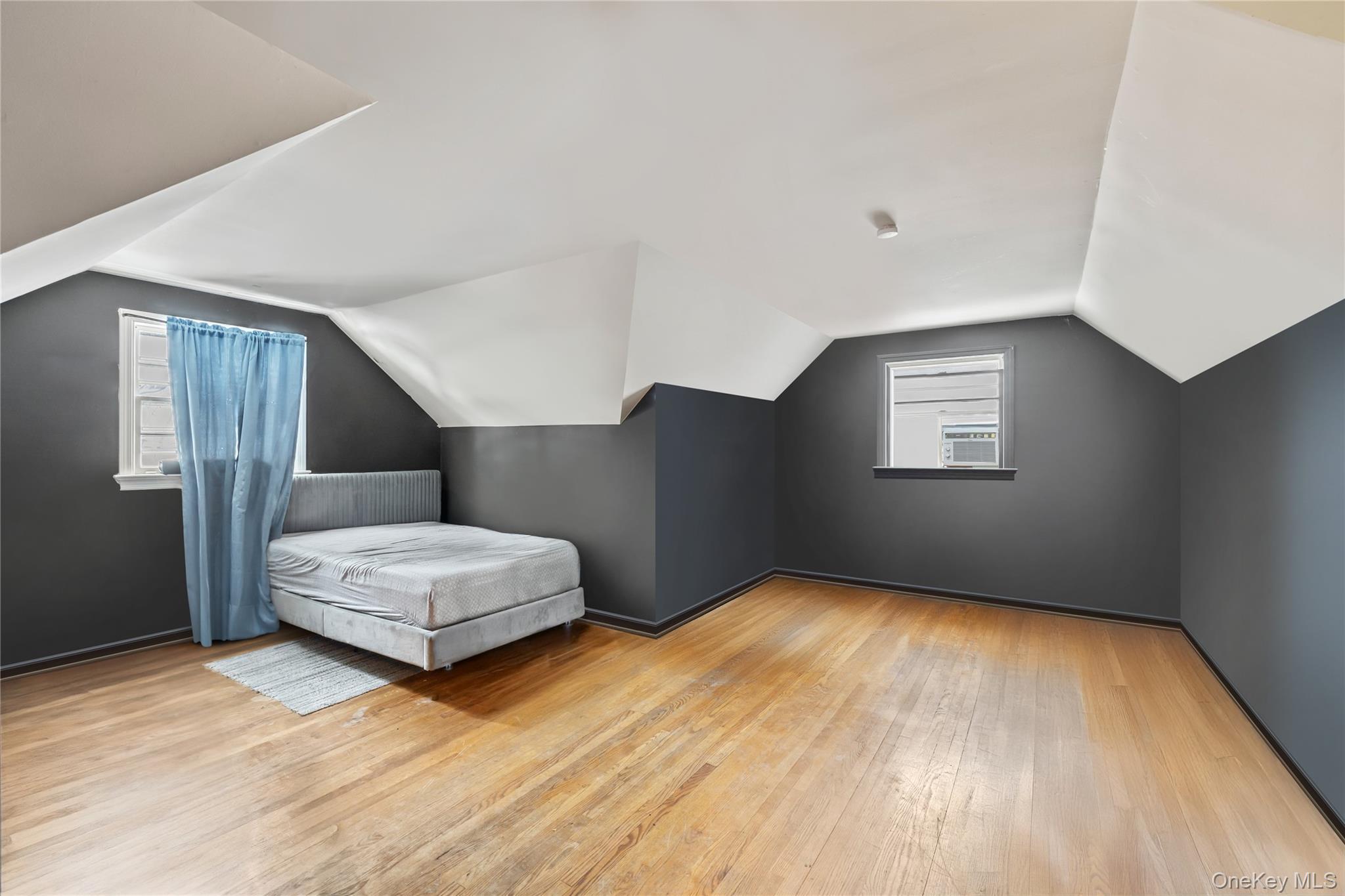 4 Haskell Avenue Suffern, NY 10901 - Photo 11 of 24 a bedroom with a bed and wooden floor