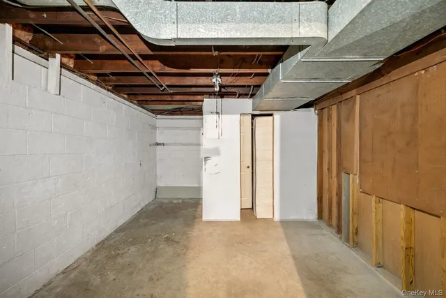a view of hallway with wooden walls