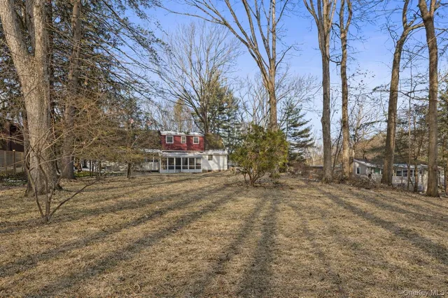 a view of a trees with a yard