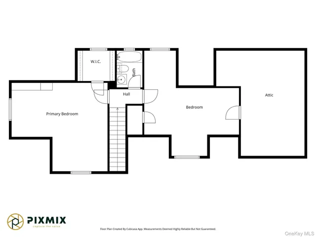 a white wall with painting on th wall