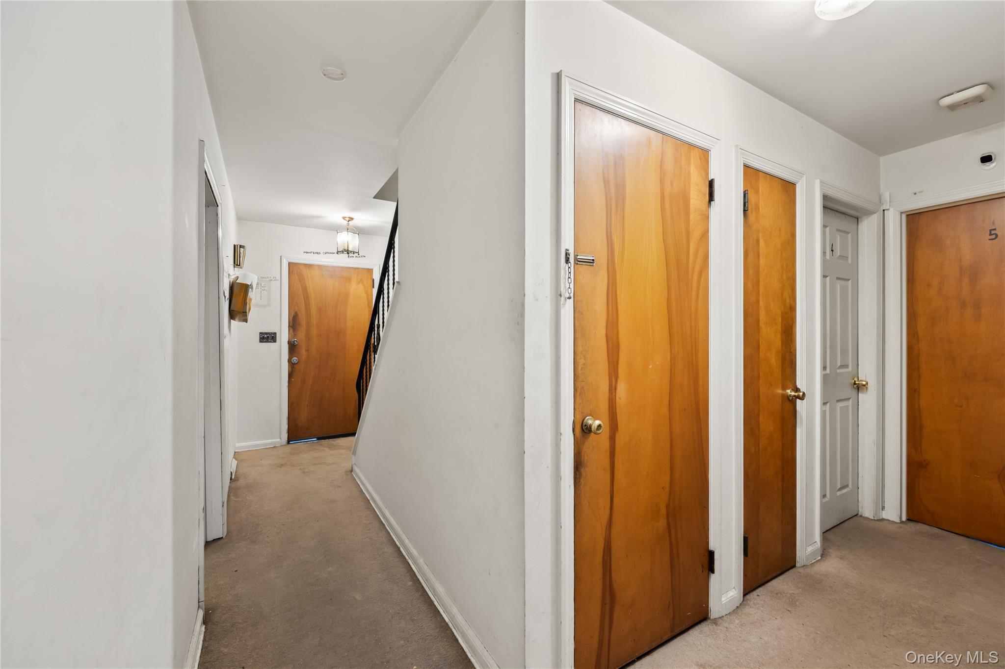 4 Haskell Avenue Suffern, NY 10901 - Photo 3 of 24 a view of a hallway with wooden floor and a bathroom