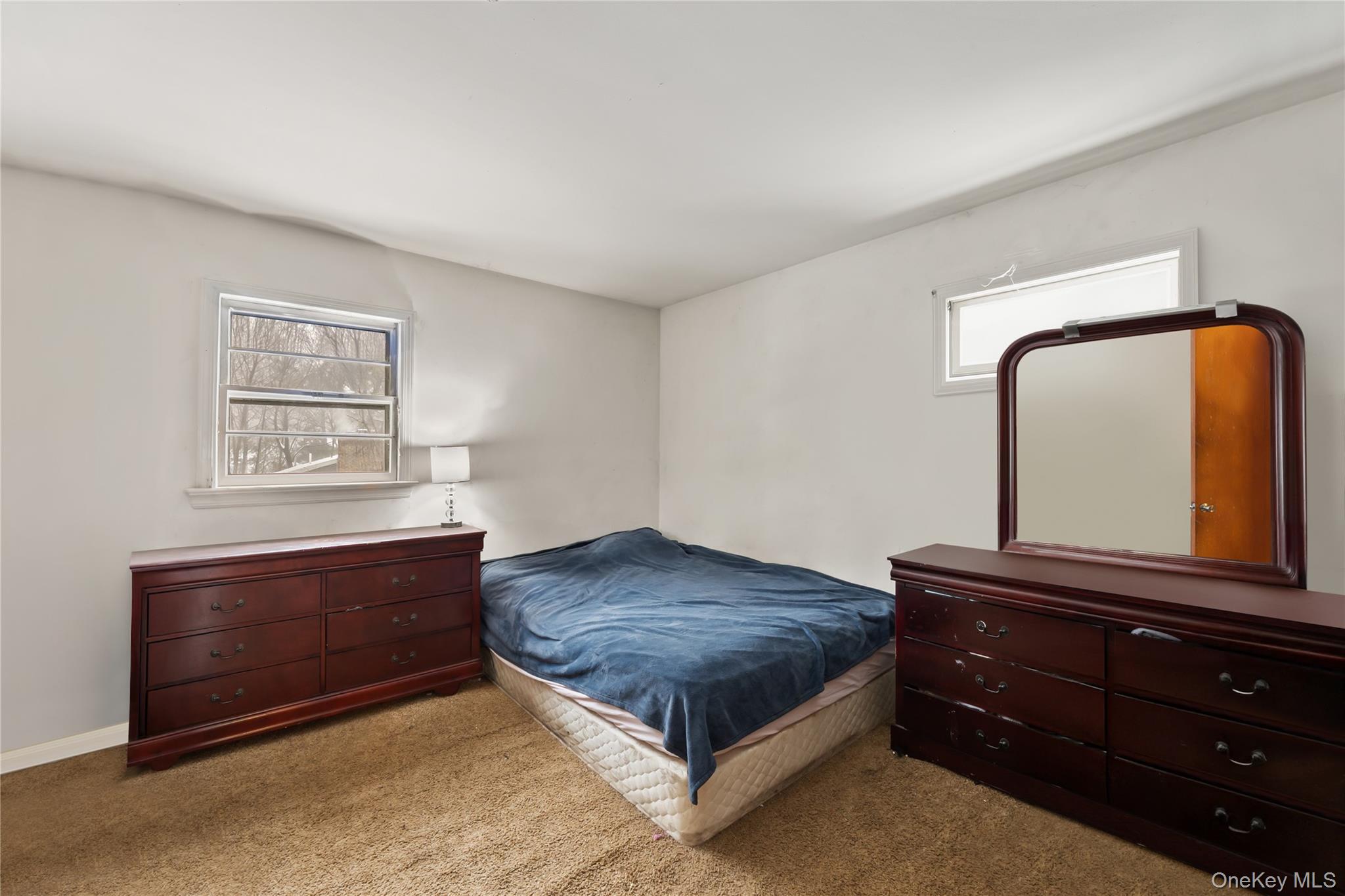 4 Haskell Avenue Suffern, NY 10901 - Photo 9 of 24 a living room with a bed and a dresser