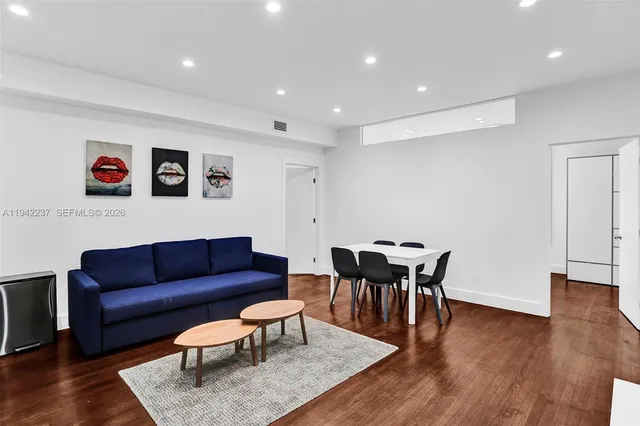 a view of a livingroom with furniture and wooden floor