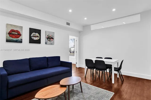 a view of a livingroom with furniture and a couch