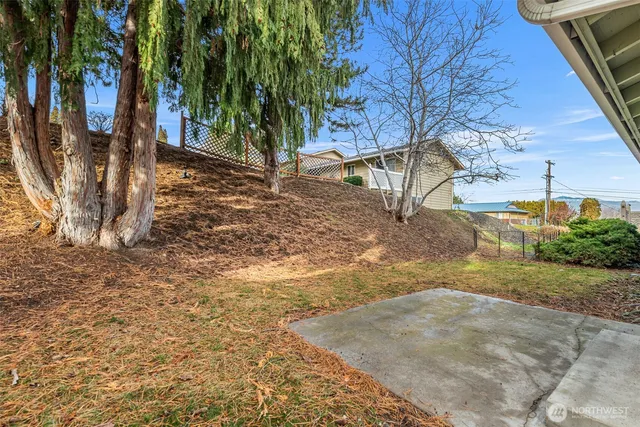 a view of a yard with swimming pool