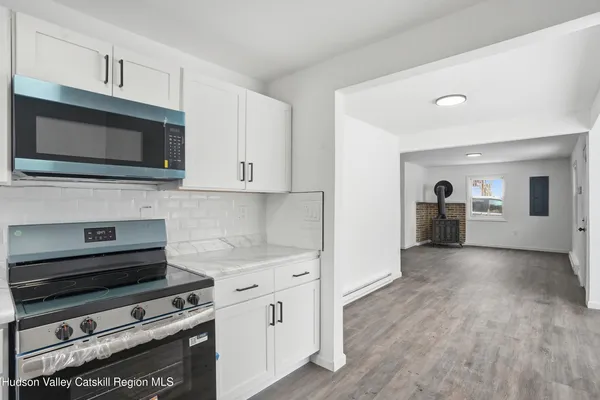 a kitchen with a stove and a microwave