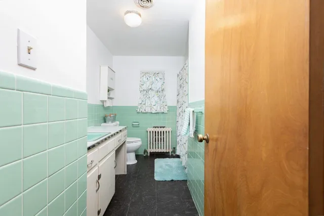 a view of an empty room with a fireplace