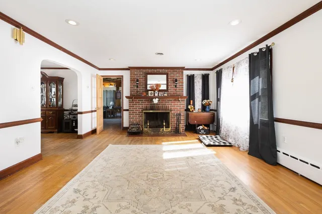 a living room with furniture and a rug