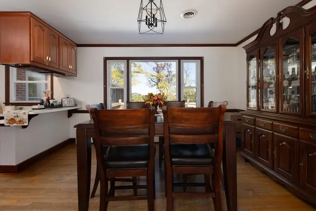 a kitchen with granite countertop a sink stove and cabinets