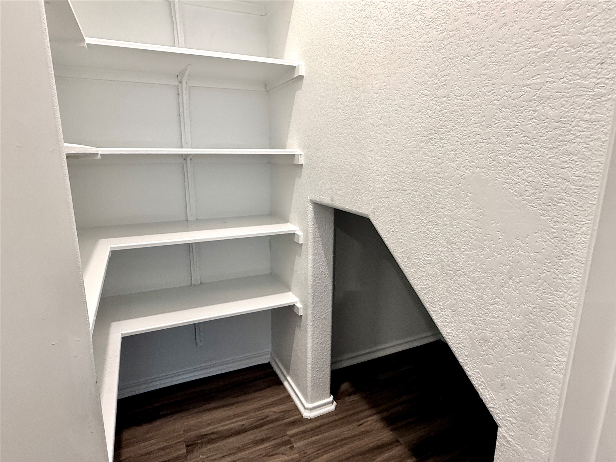 129 Perfect World Loop Jarrell, TX 76537 - Photo 11 of 31 Streamlined shelves and a clever alcove maximize storage potential in this well-appointed space.