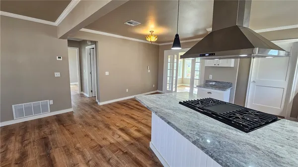 a bedroom with a bed and a stove