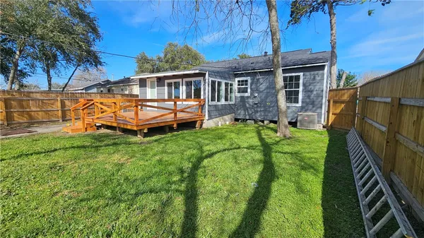 a backyard of a house with lots of green space