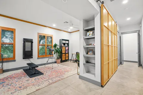 a kitchen with kitchen island granite countertop a stove and a sink