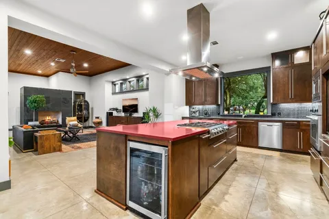 a view of living room with furniture and a large window