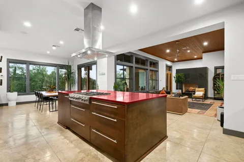 a en suite bathroom with a double vanity sink a mirror and shower