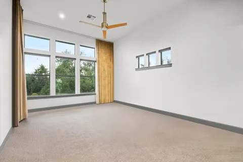 a bedroom with furniture and a book shelf