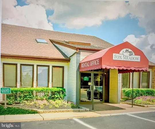 front view of a brick building with a window