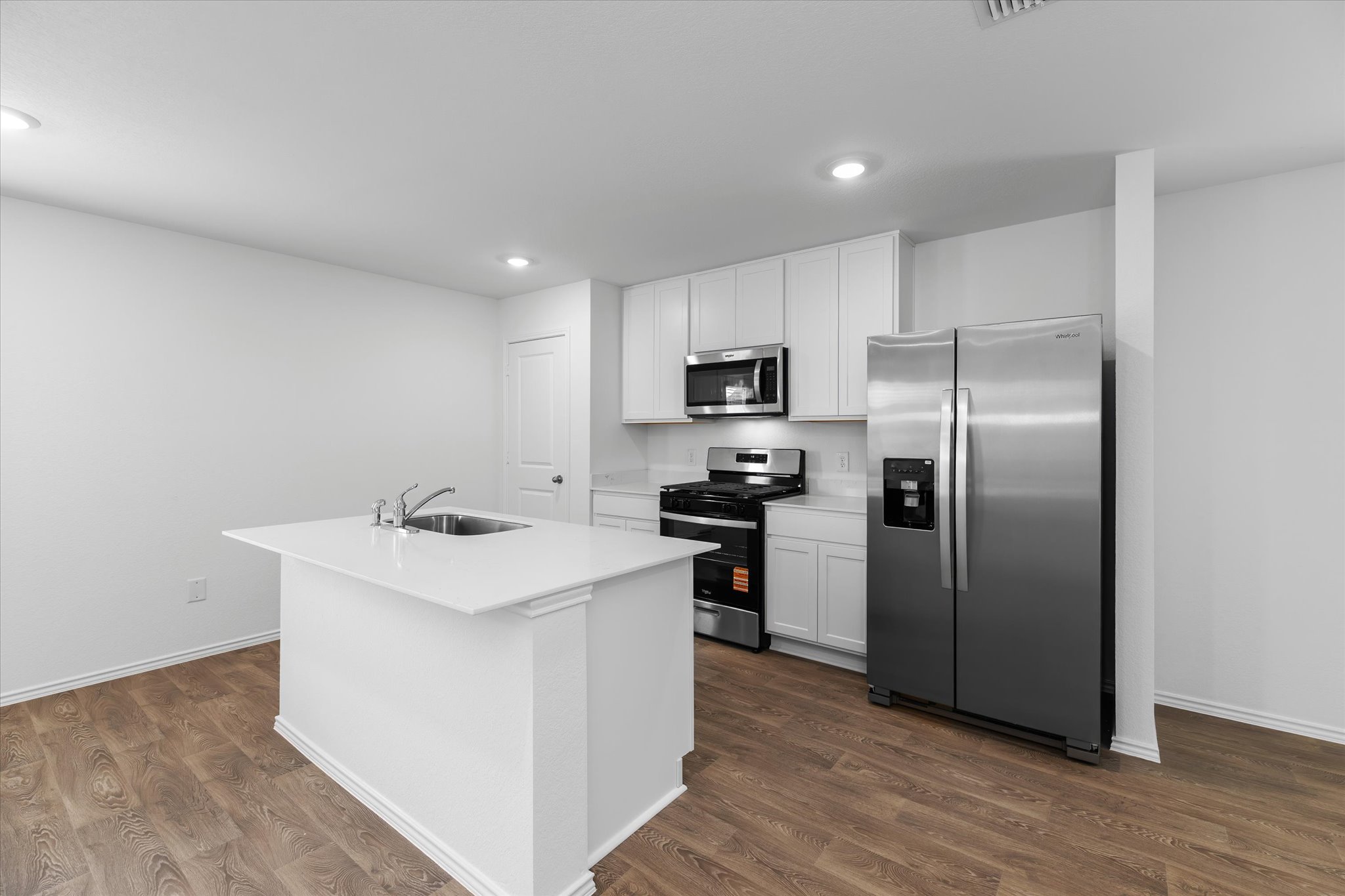 456 Sandringham Loop Kyle, TX 78640 - Photo 33 of 40 A well-appointed kitchen features a large center island and modern appliances, perfect for culinary pursuits.