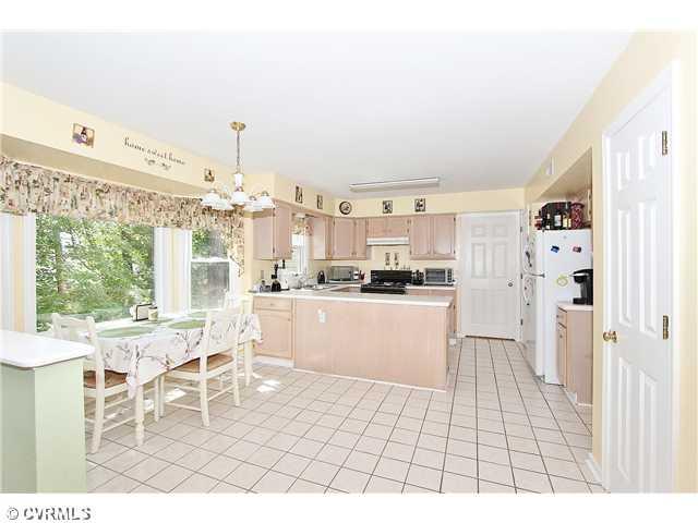 8707 Overhill Road Henrico, VA 23229 - Photo 8 of 22 Kitchen - Eat-in Kitchen with Bay Window, Ceramic Tile Floor, Gas Cooking, Door to Dining Room, Direct Entry to Laundry Room, Storage Closet, Pantry