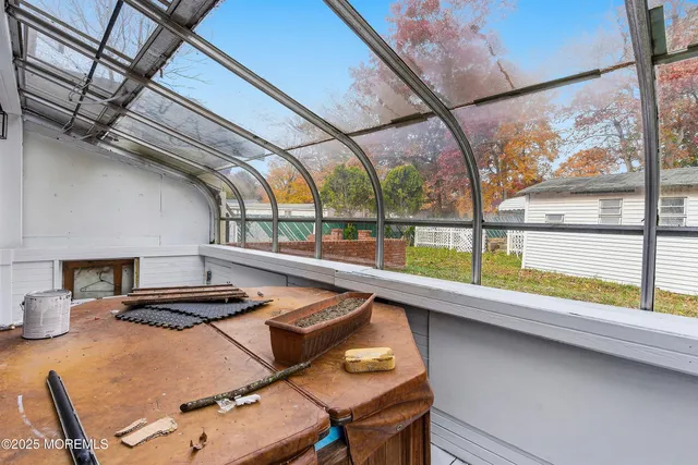 a kitchen with a stove a refrigerator and a table