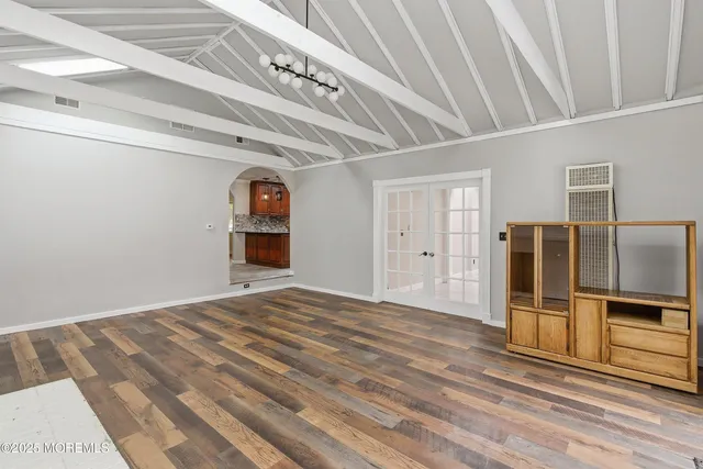 a view of a livingroom with a kitchen