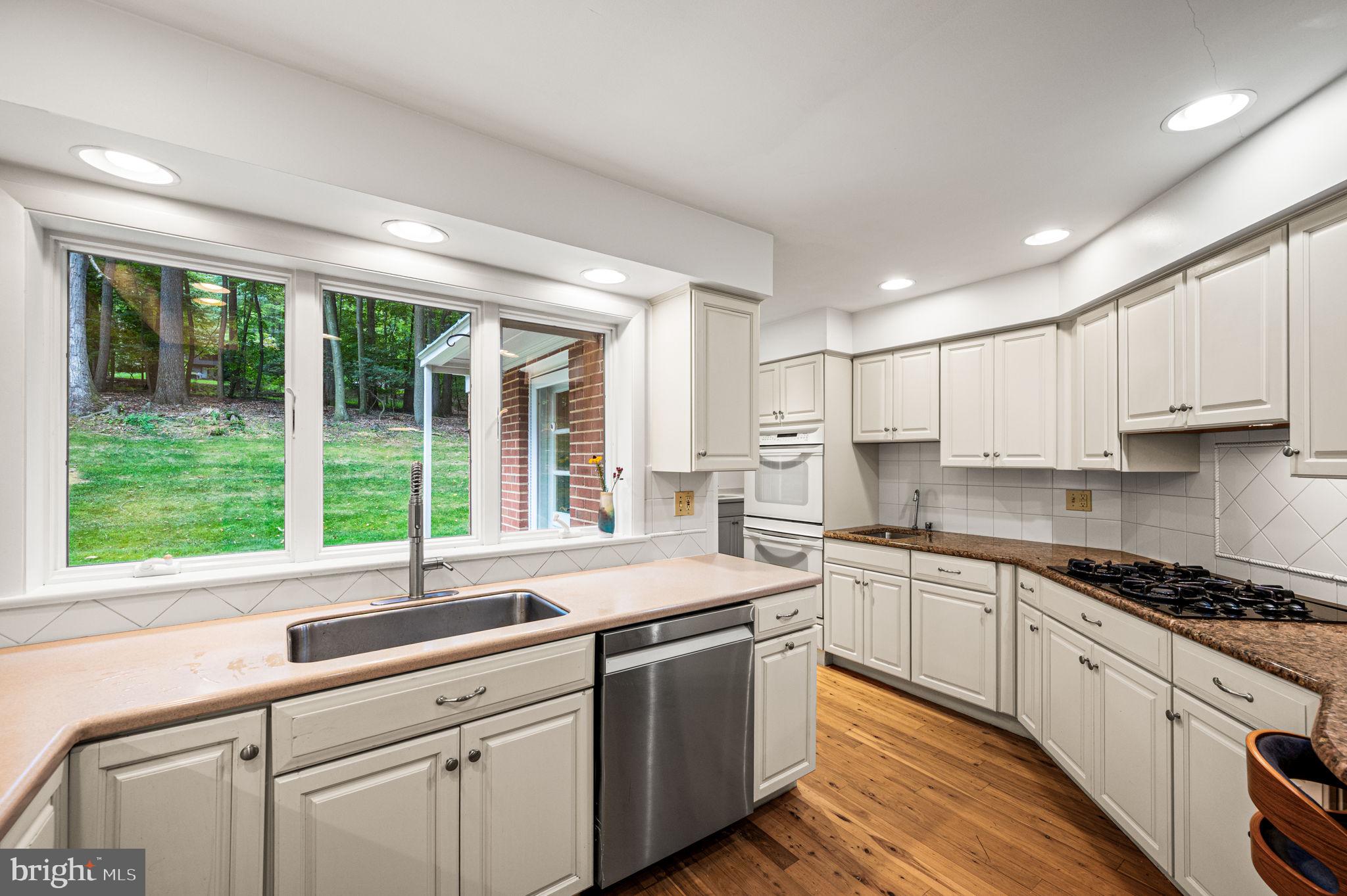 434 Pugh Road Wayne, PA 19087 - Photo 23 of 47 a kitchen with a sink stove and cabinets