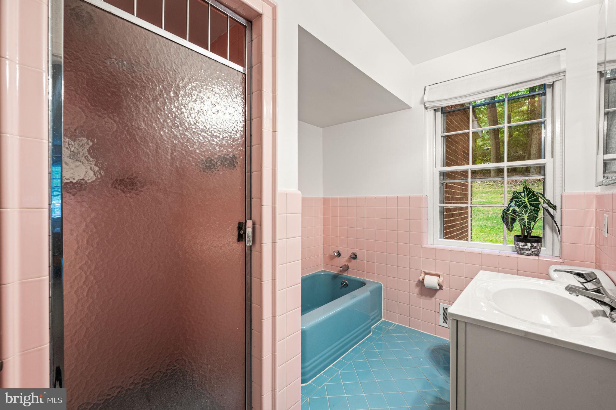 434 Pugh Road Wayne, PA 19087 - Photo 30 of 47 a bathroom with a tub sink and window