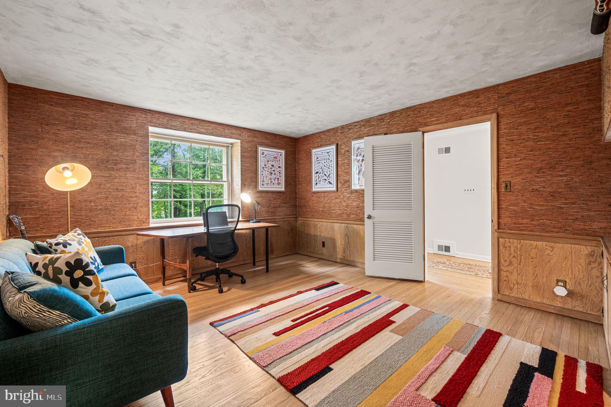 434 Pugh Road Wayne, PA 19087 - Photo 34 of 47 a living room with furniture and a floor to ceiling window