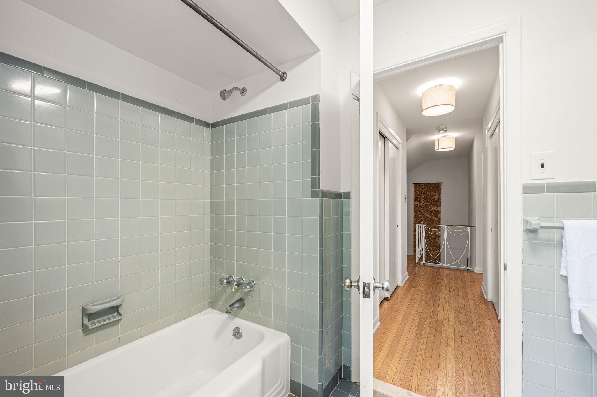 434 Pugh Road Wayne, PA 19087 - Photo 37 of 47 a bathroom with a bathtub a toilet a sink and shower